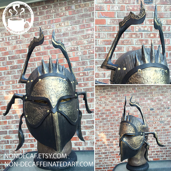 Photo of a mask shaped like a styelized Scarab